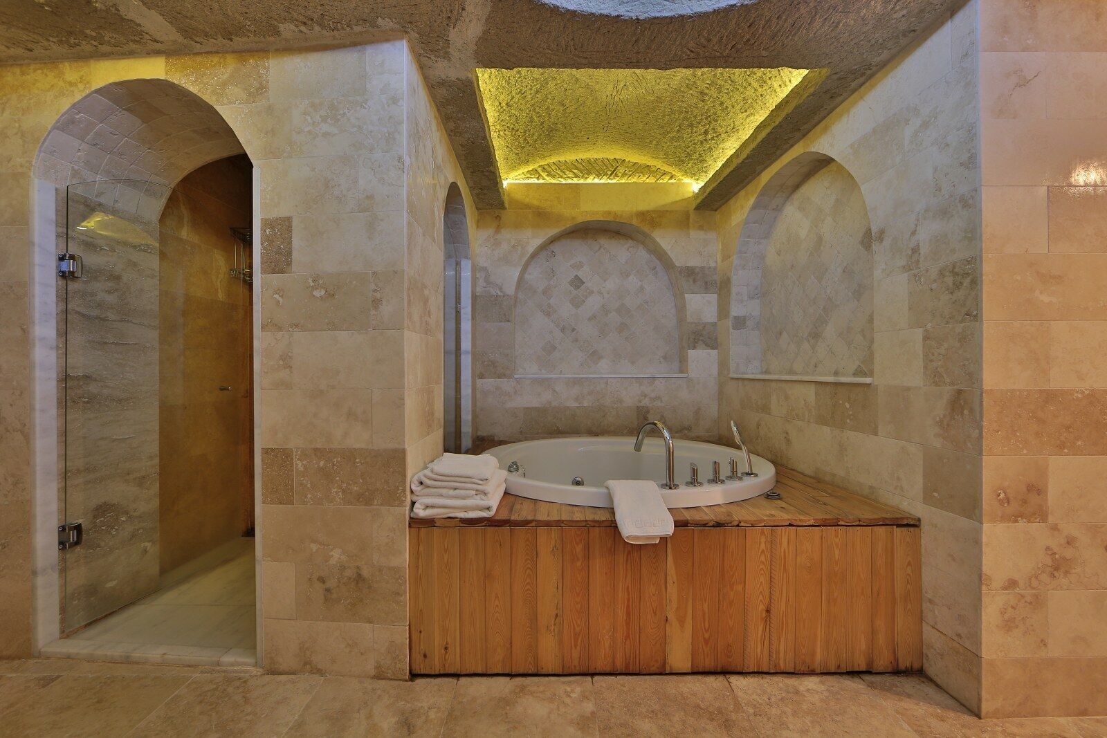 sultan cave suite | bathroom | shower, designer toiletries, hair dryer, slippers
