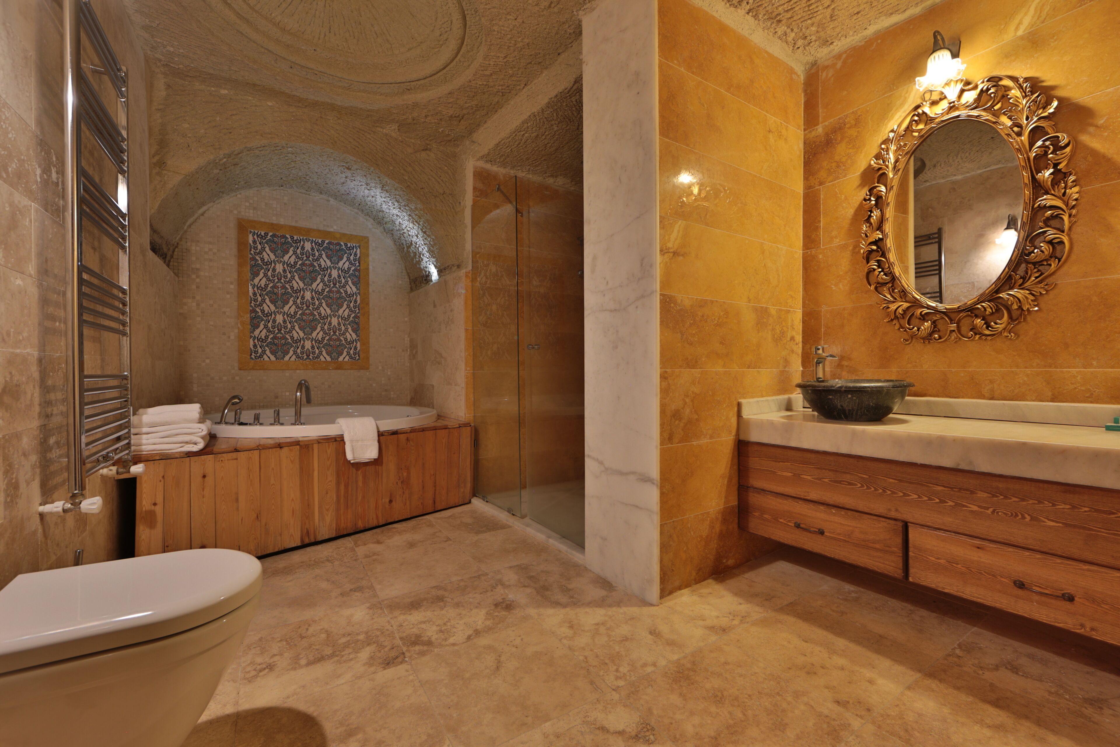 sultan cave suite | bathroom | shower, designer toiletries, hair dryer, slippers