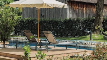 Outdoor pool, open 8:00 AM to 8:00 PM, pool umbrellas, pool loungers