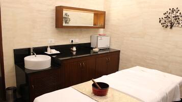 Relax in a stylish room with a large bed, sink, and mirror.