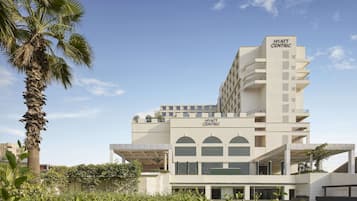 Experience the sleek, contemporary design of Hyatt Centric's modern architecture, featuring multiple levels and spacious balconies.