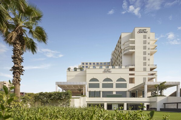 Experience the sleek, contemporary design of Hyatt Centric's modern architecture, featuring multiple levels and spacious balconies.