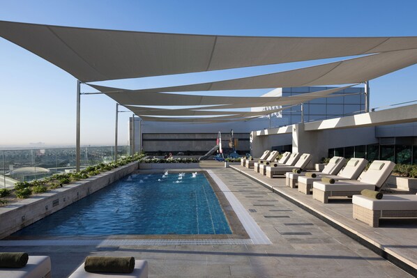 Outdoor pool, open 8:00 AM to 7:00 PM, pool umbrellas, pool loungers