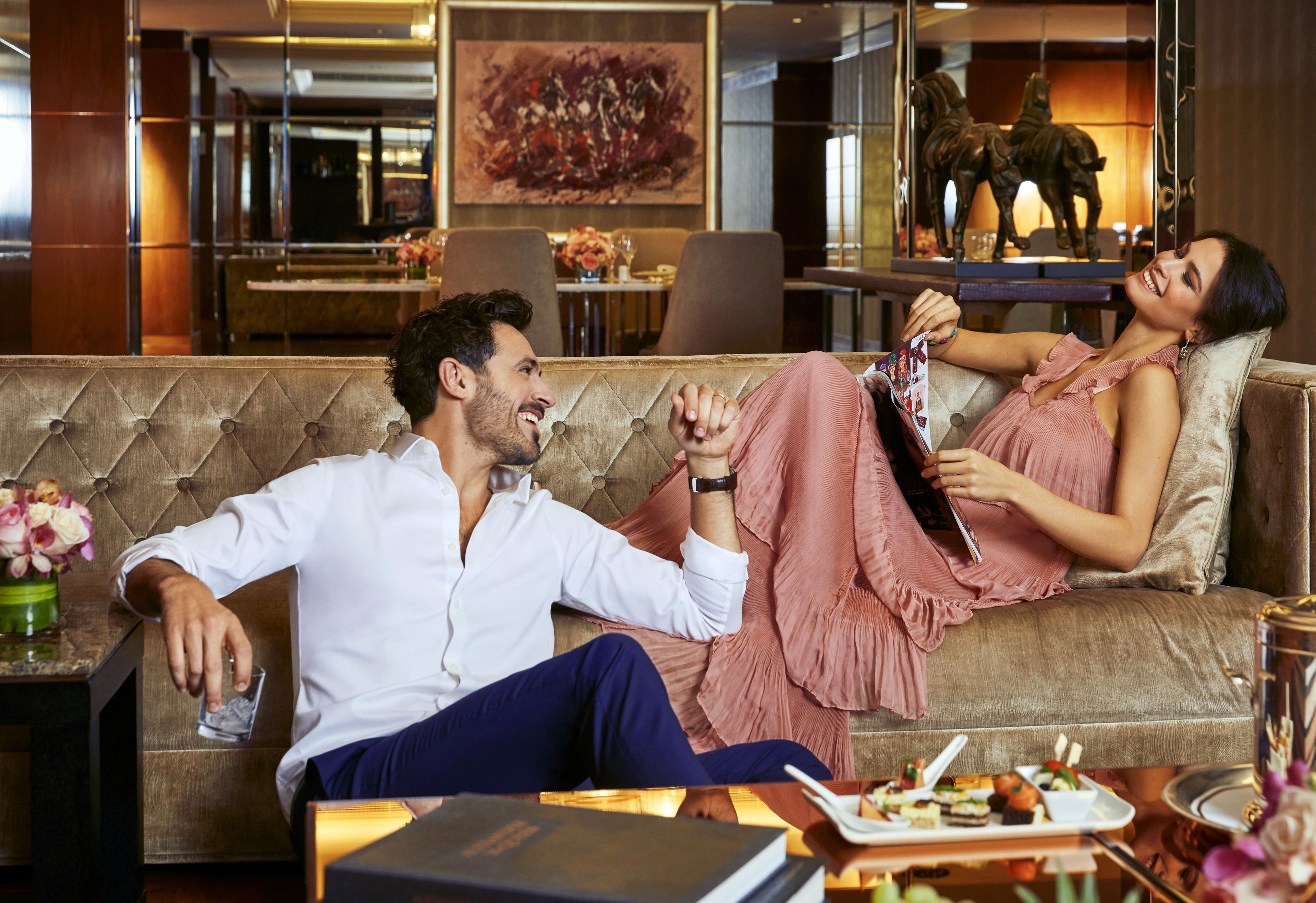 meydan presidential suite two bedroom | living area | 55-inch smart tv with satellite channels