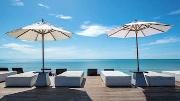 Private beach, white sand, sun loungers, beach umbrellas