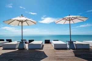 Private beach, white sand, sun loungers, beach umbrellas