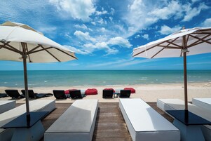 Private beach, white sand, sun loungers, beach umbrellas