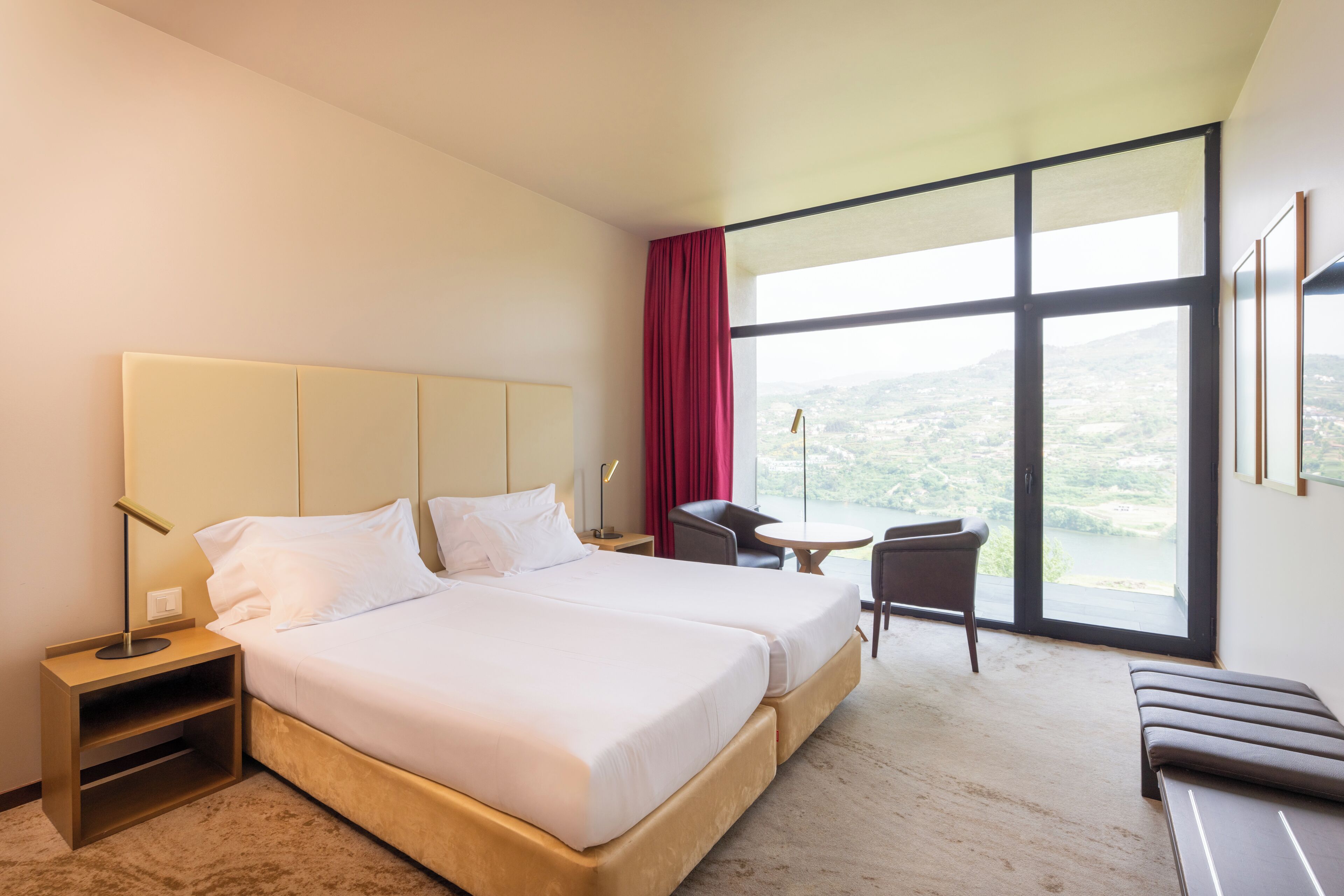 Twin Room, River View | Minibar, in-room safe, desk, blackout curtains