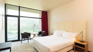 Double Room, River View | Minibar, in-room safe, desk, blackout curtains
