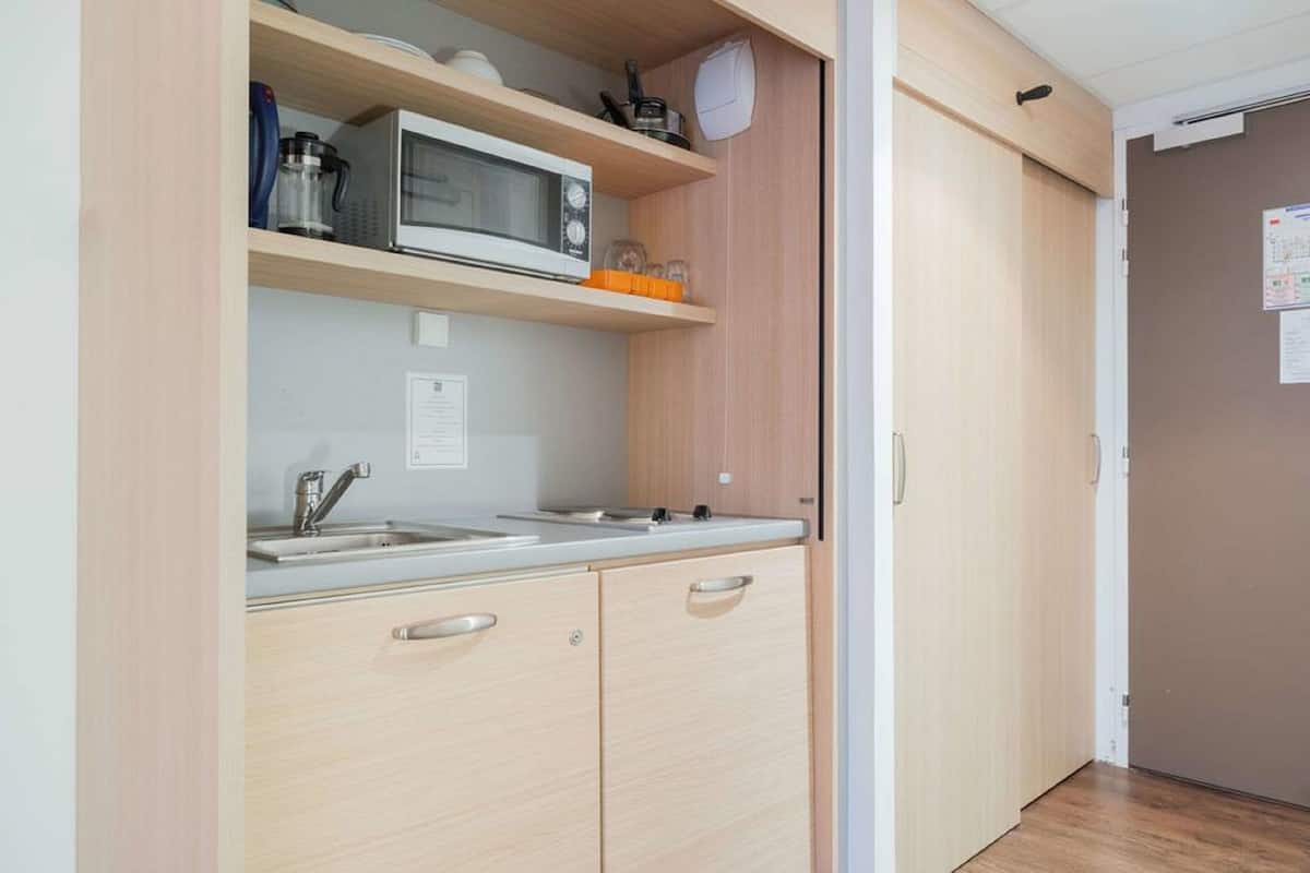 premium bedding, memory-foam beds, desk, blackout curtains