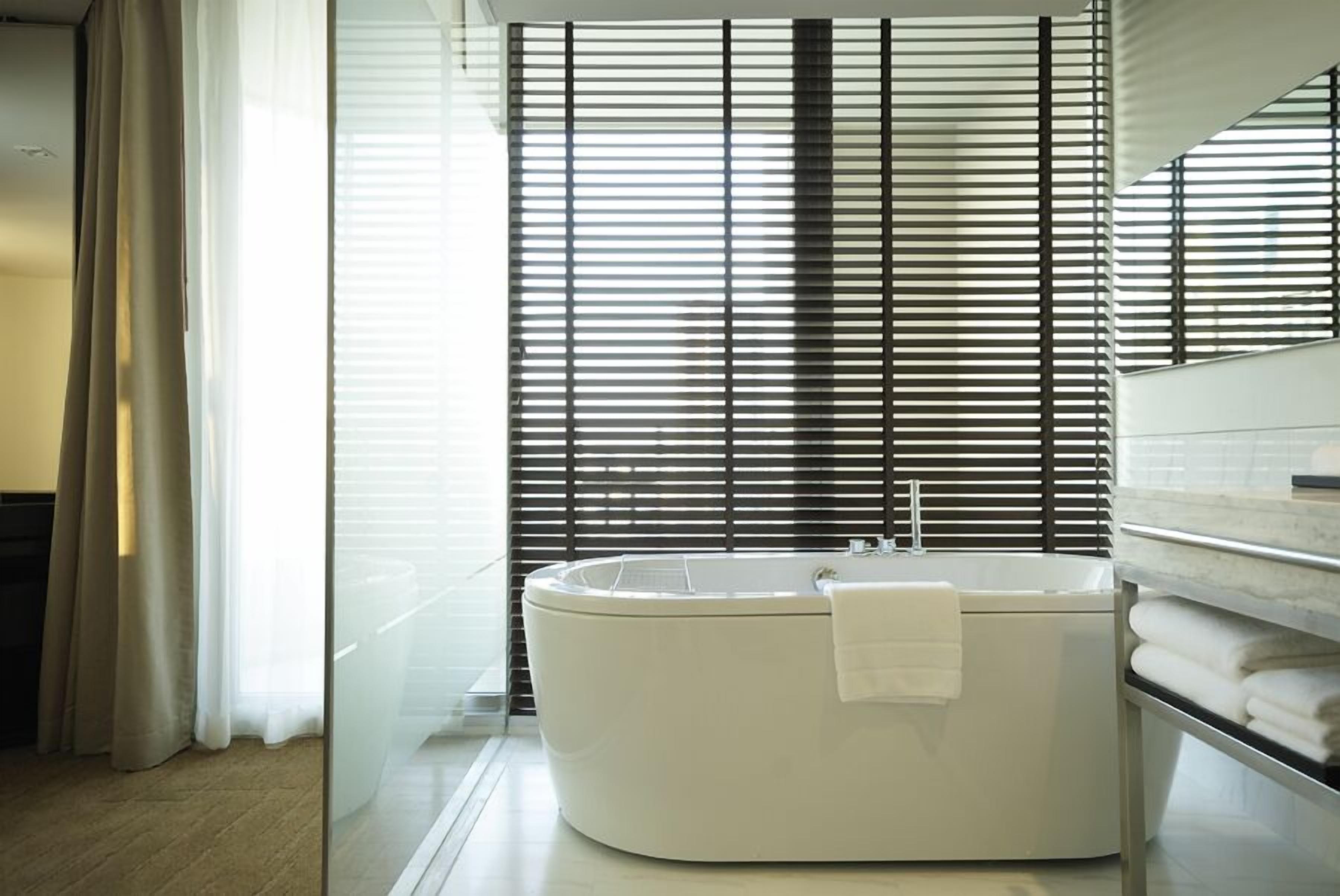 one bedroom suite king | bathroom | free toiletries, hair dryer, bathrobes, slippers