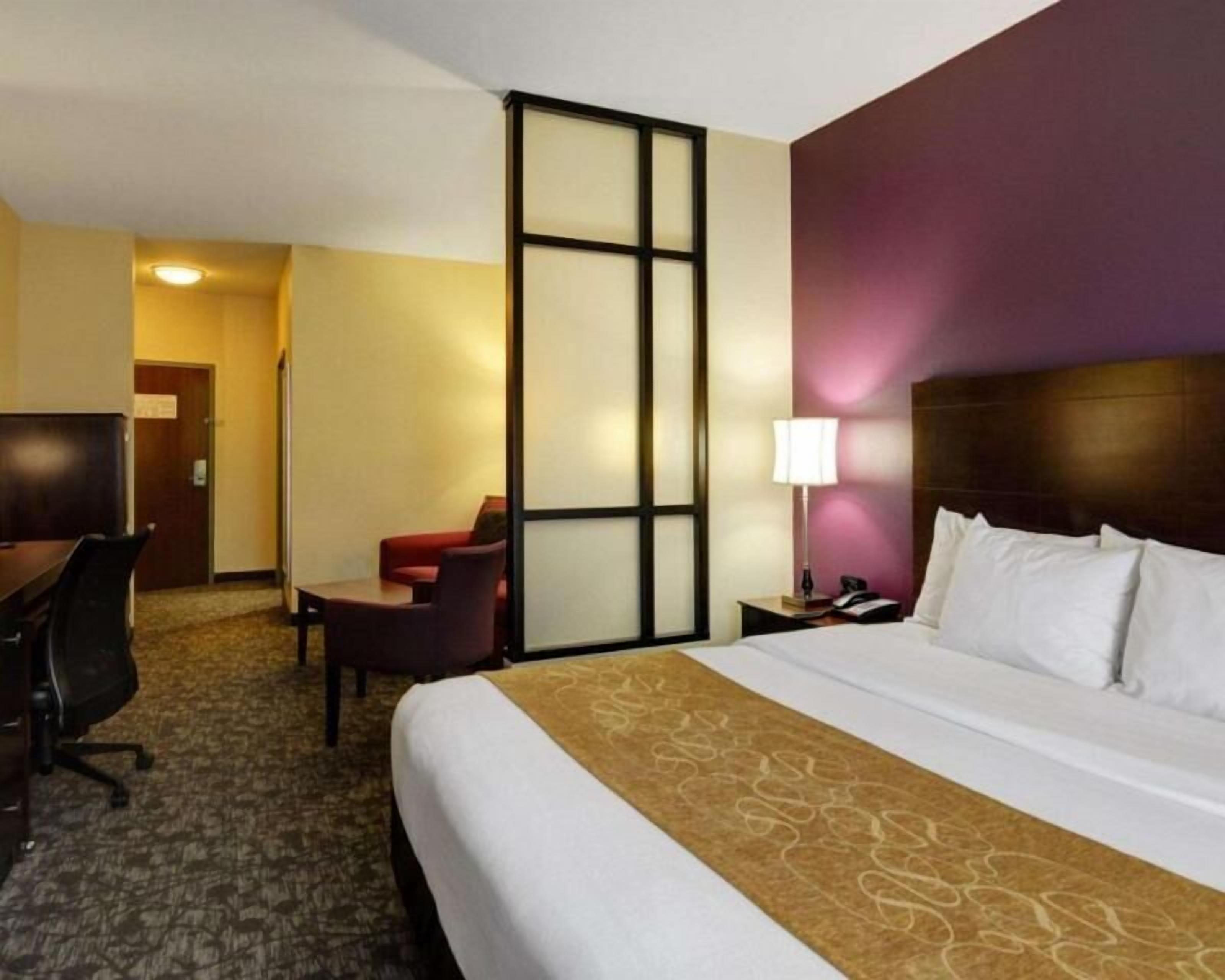 Premium bedding, desk, laptop workspace, blackout drapes