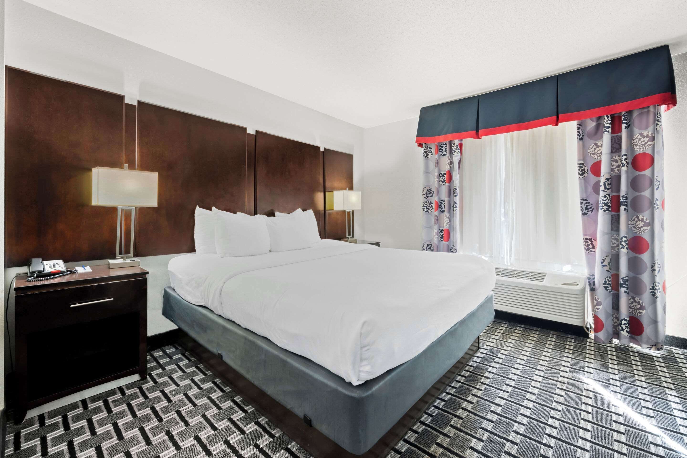 desk, laptop workspace, blackout curtains, iron/ironing board