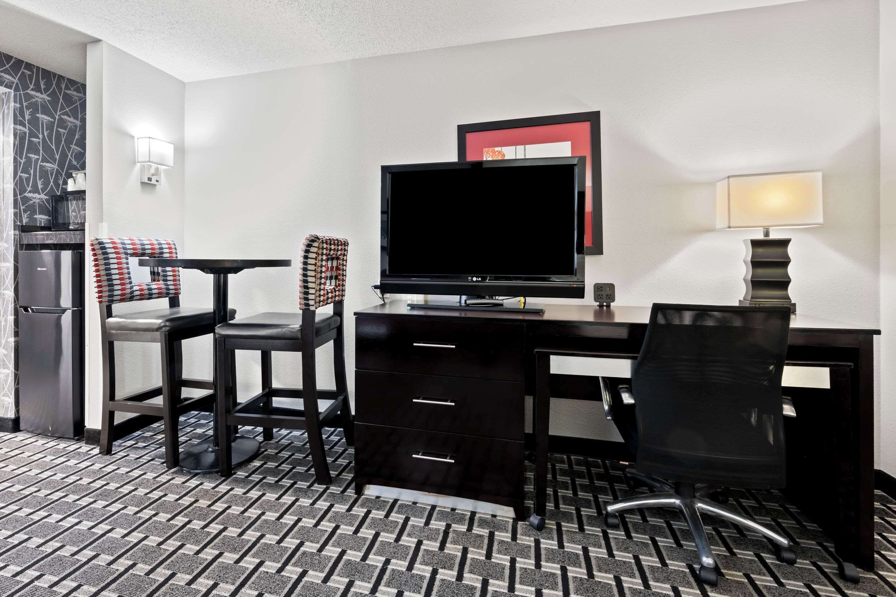 desk, laptop workspace, blackout curtains, iron/ironing board