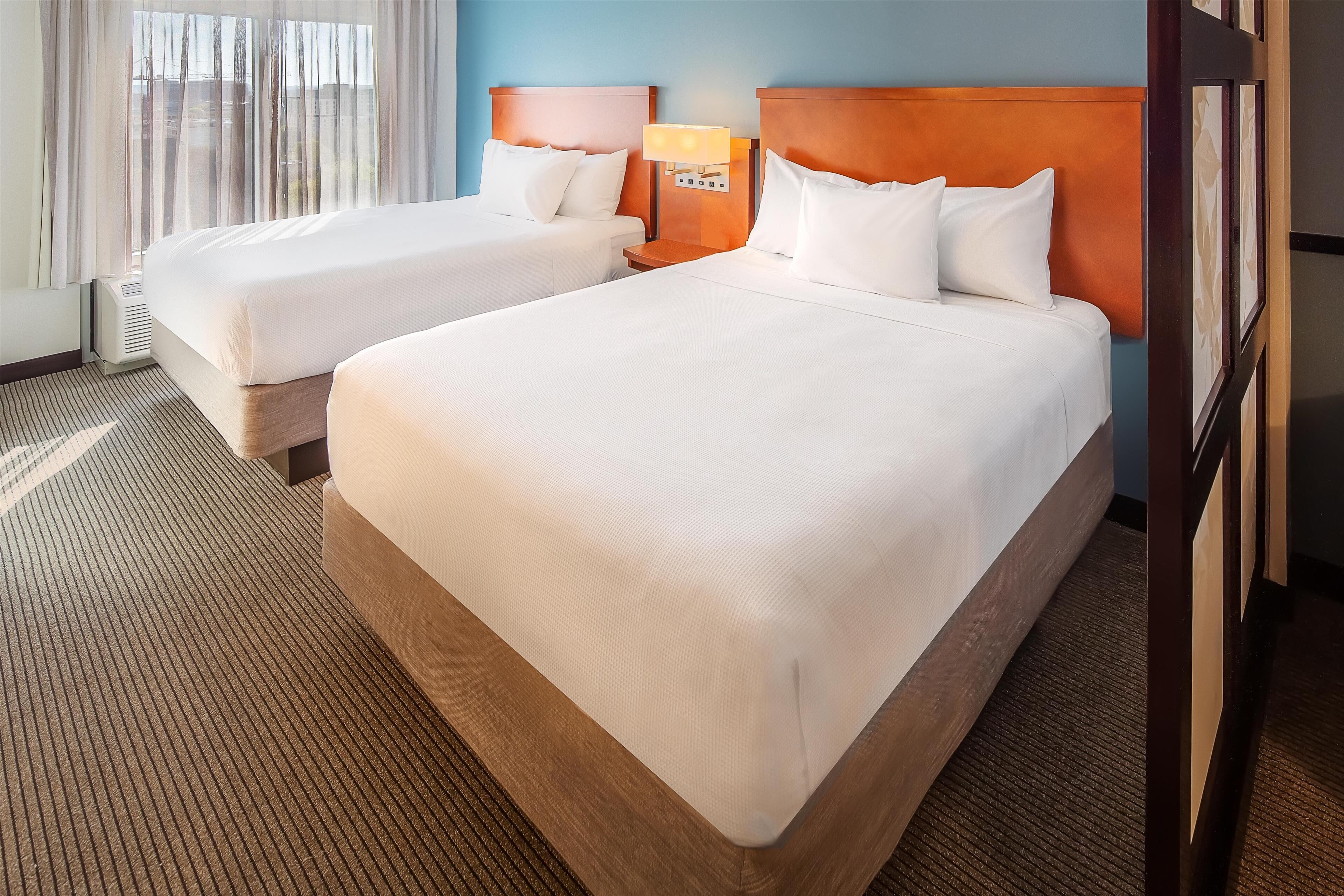 hypo-allergenic bedding, pillow-top beds, desk, blackout curtains