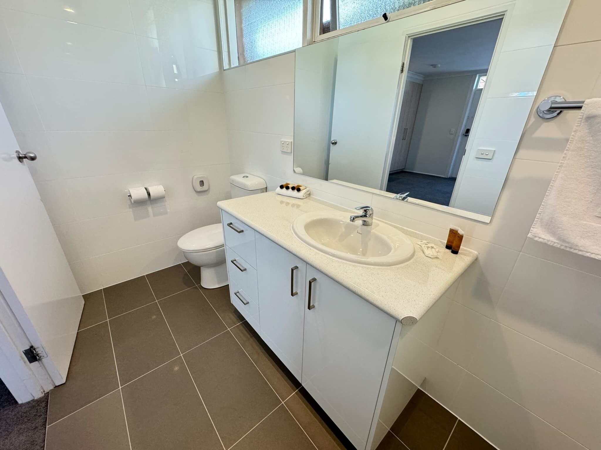 family room with two queen beds | bathroom | free toiletries, hair dryer, towels, soap