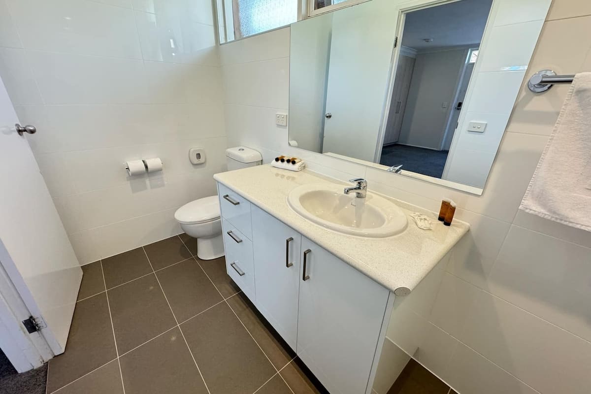 family room with two queen beds | bathroom | free toiletries, hair dryer, towels, soap