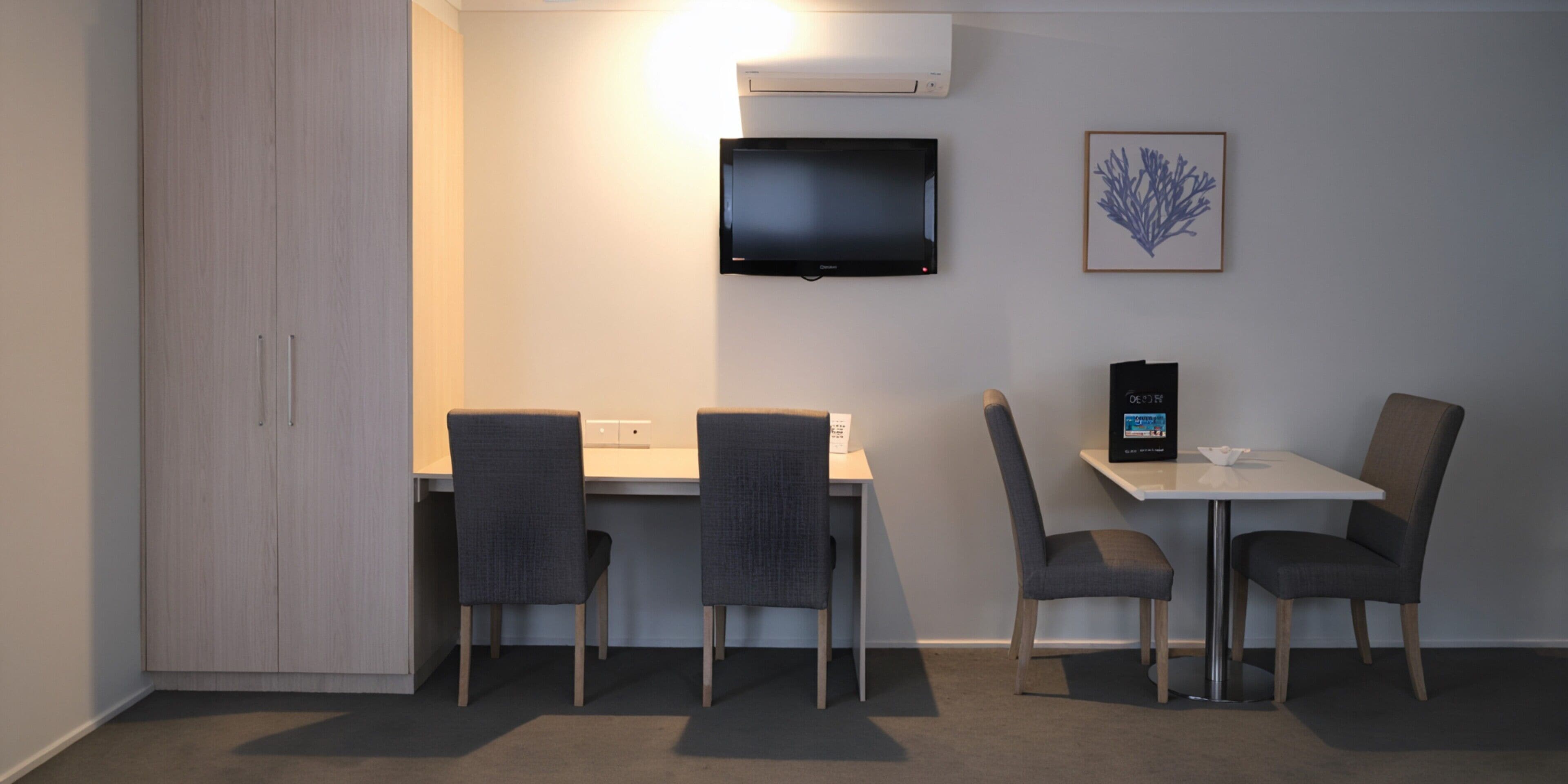 family room with two queen beds | television