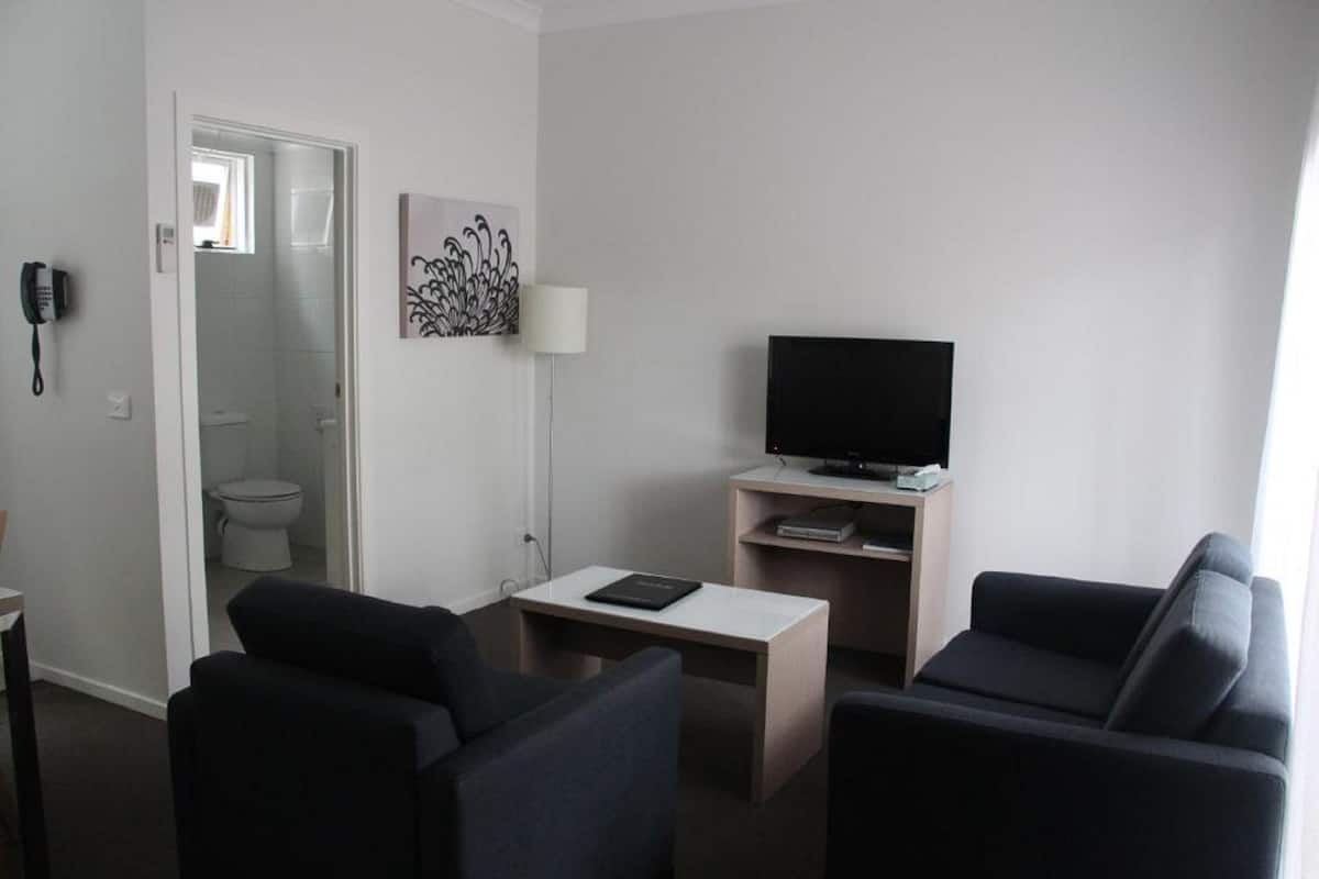 two bedroom family unit | living room | 45-inch tv with cable channels