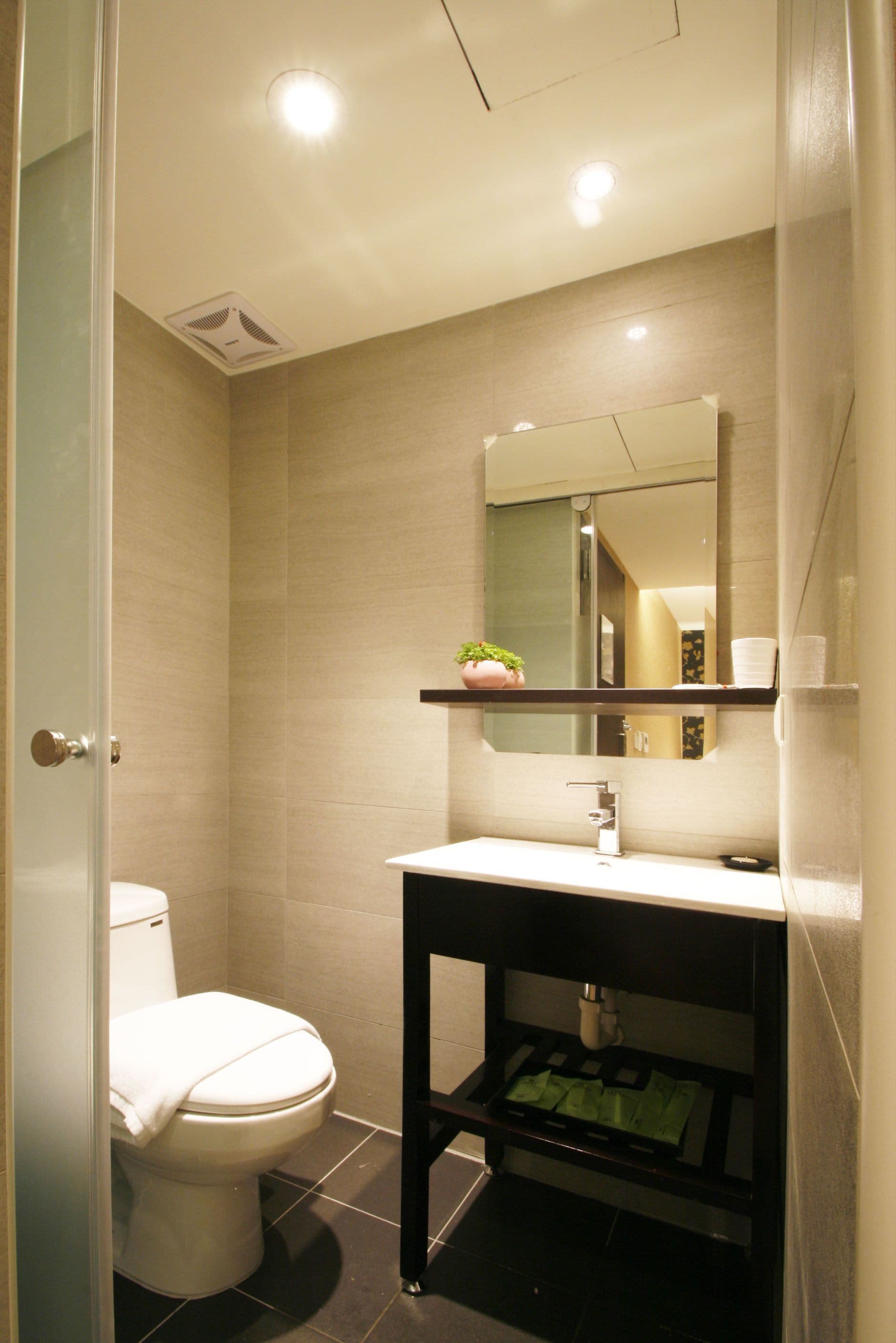 shower, hair dryer, slippers, towels