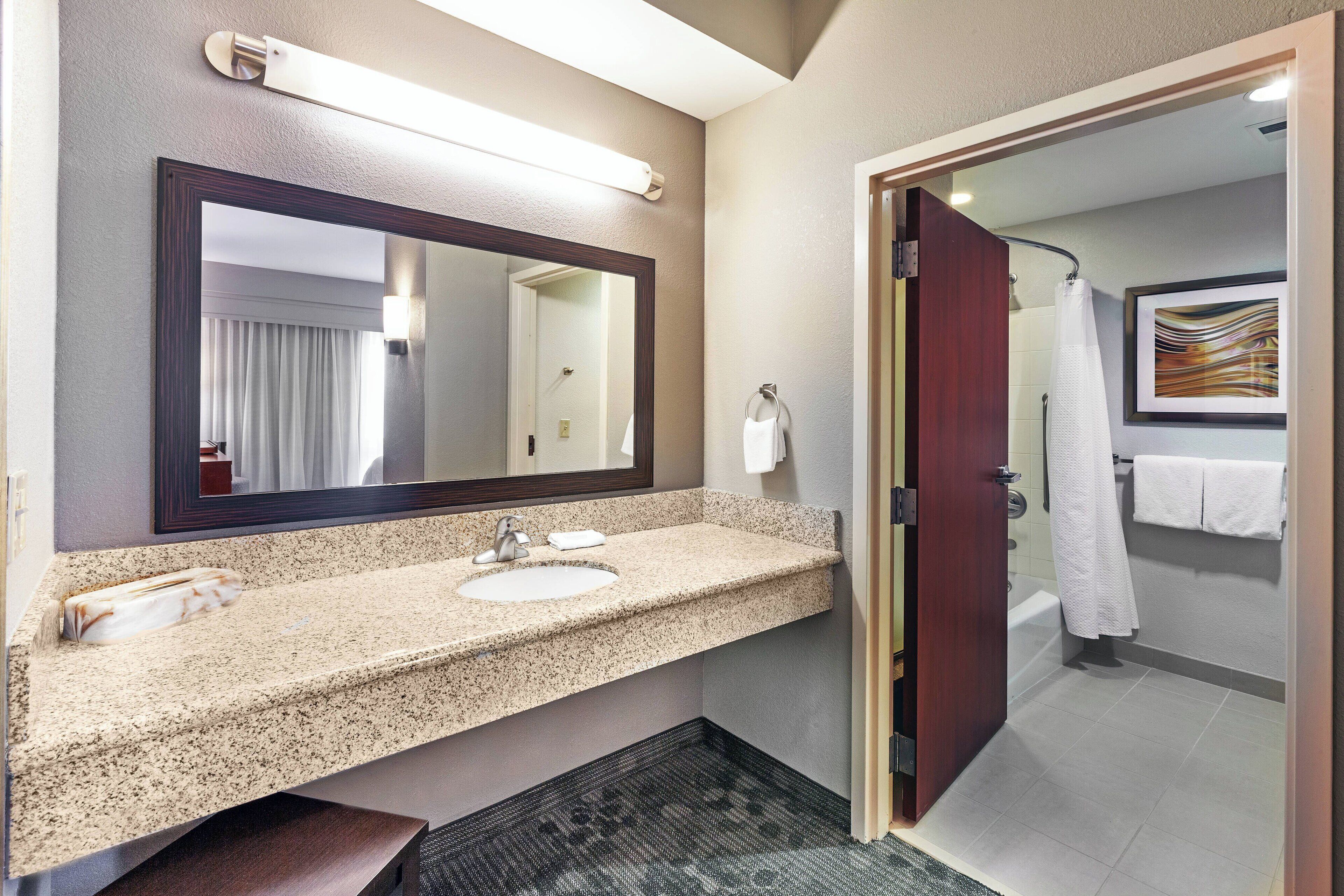suite, 1 bedroom, non smoking, corner | bathroom | combined shower/bathtub, free toiletries, hair dryer, towels
