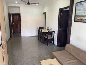 Suite AC Room with Balcony | Living area | TV - Valentines Retreat- Near Candolim Beach (Candolim)