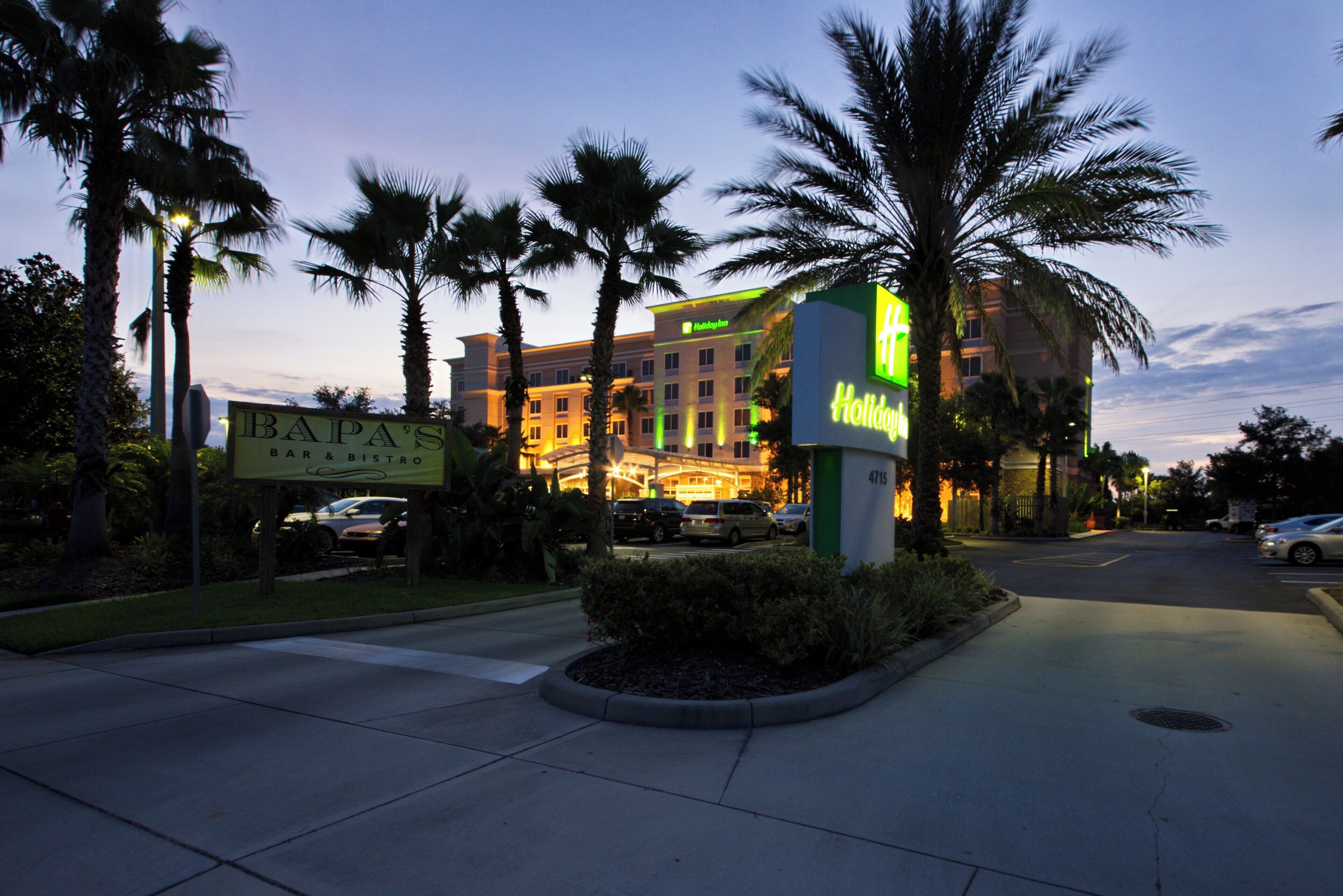 A hotel with a bar and bistro named 'BAPA'S' and a Holiday Inn sign.