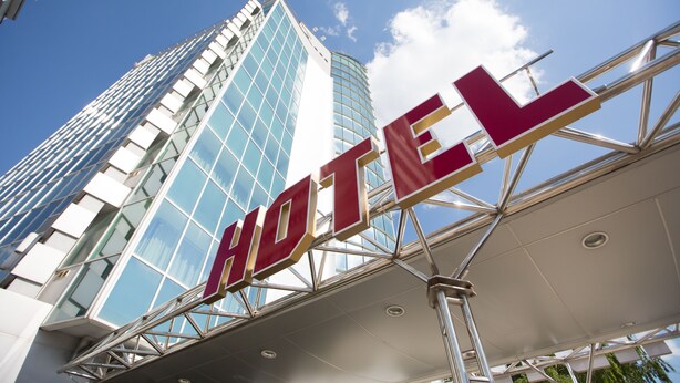 A hotel sign with a modern design, featuring large letters and a metallic structure. - Jumbo Hotel (Chisinau)