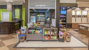 A grocery store named "The Garden Market" with sections for frozen and chilled items, and various snacks and beverages. - Hilton Garden Inn Pensacola Airport - Medical Center (Pensacola)