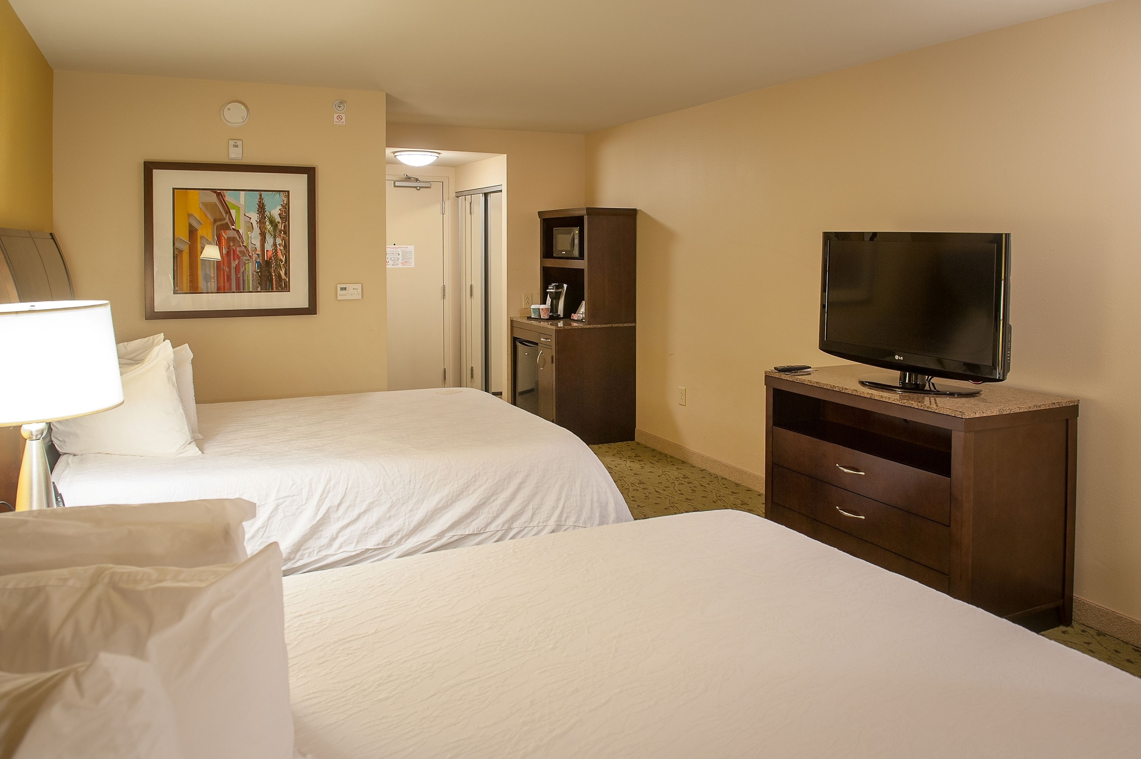 two queens evolution rm | hypo-allergenic bedding, minibar, desk, blackout curtains