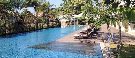 Outdoor pool, pool umbrellas, sun loungers