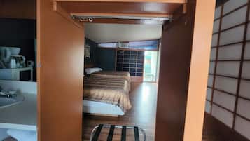 Suite (2 Queen Beds and 1 Double) | Living area | TV