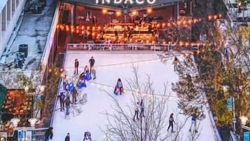 A Courtyard by Marriott hotel with an outdoor ice skating rink.