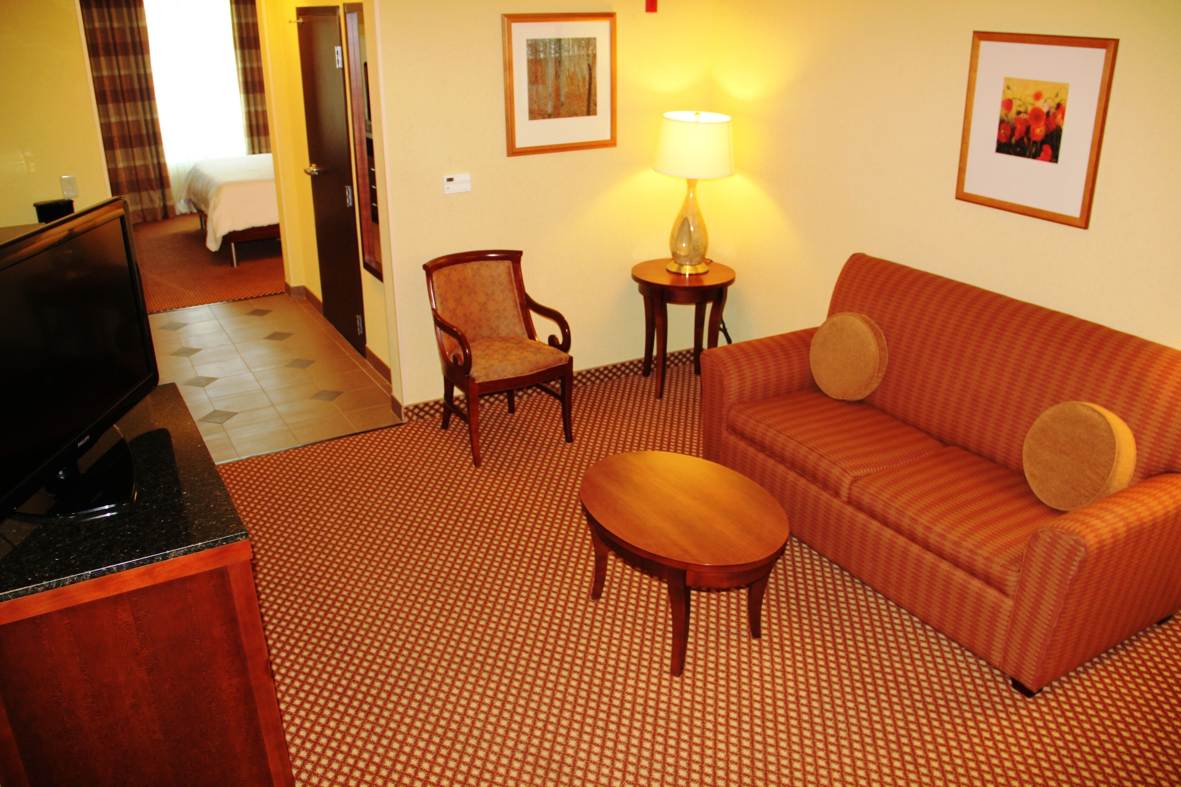 king bedroom evolution suite | living area | 42-inch led tv with satellite channels, tv, ipod dock