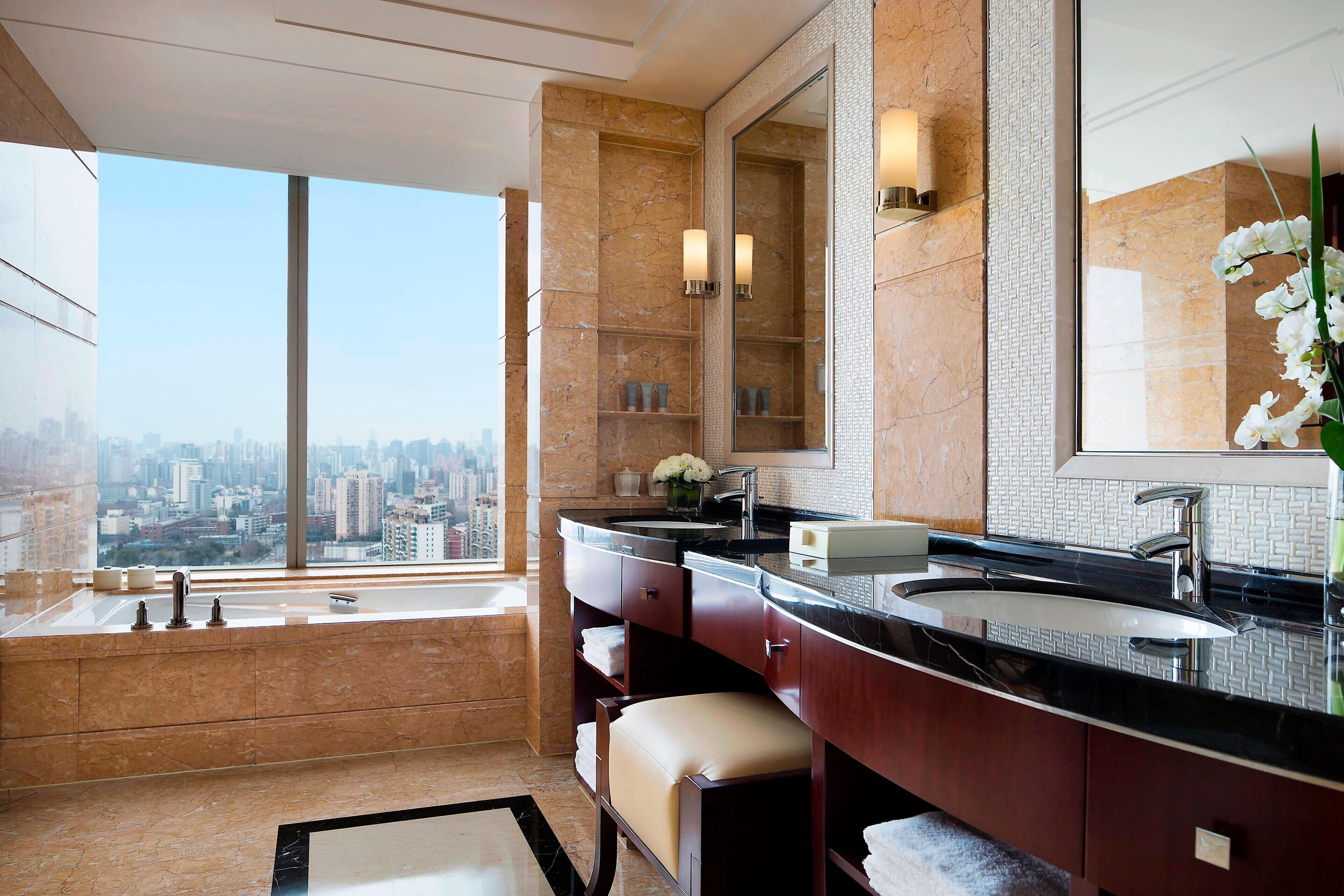 separate bathtub and shower, deep-soaking bathtub, designer toiletries