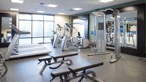 A gym with treadmills, elliptical machines, and weight stations. - Hampton Inn & Suites Vineland (Vineland)