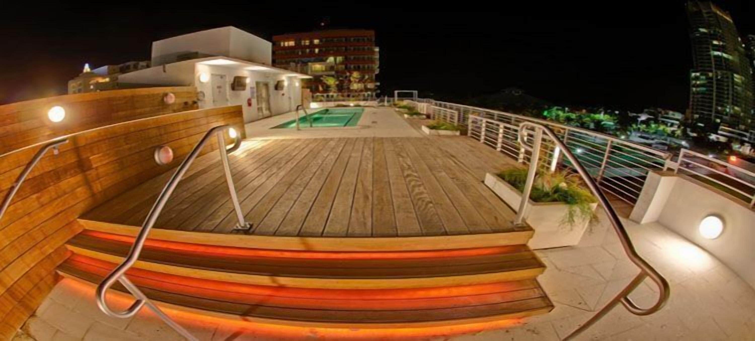 outdoor pool, pool umbrellas, pool loungers