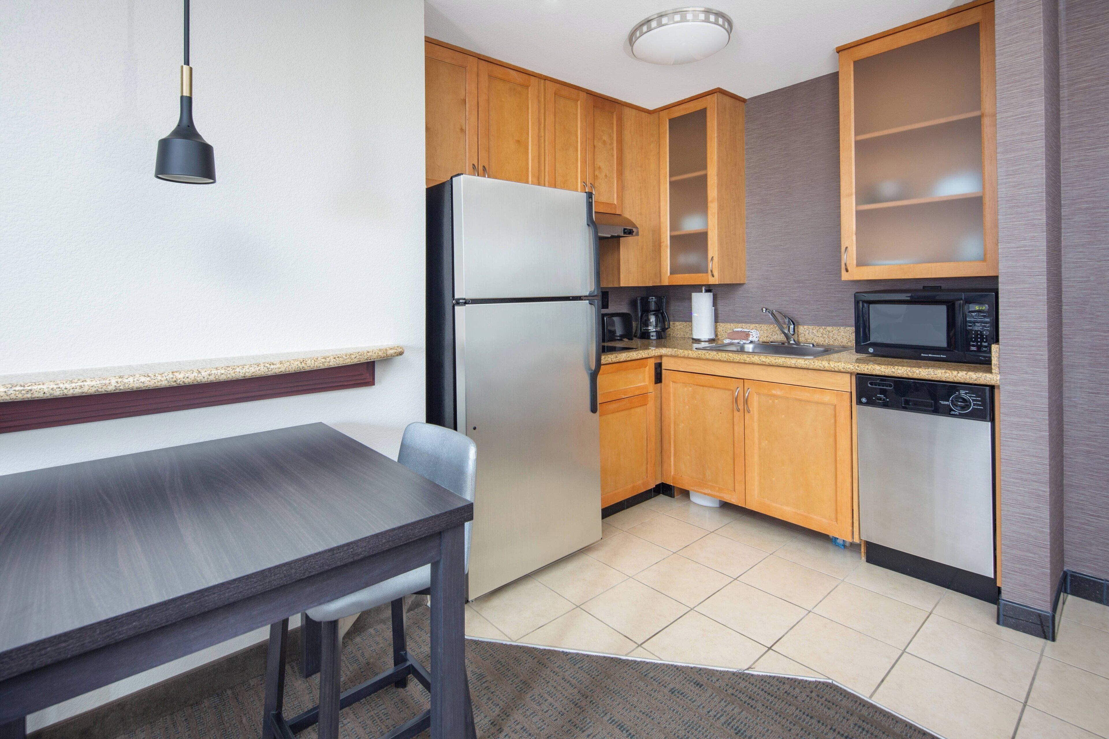 suite, 1 bedroom, non smoking | private kitchen | fridge, microwave, stovetop, dishwasher