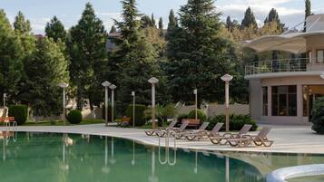 Indoor pool, seasonal outdoor pool, pool umbrellas, pool loungers