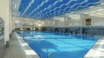Indoor pool, seasonal outdoor pool, pool umbrellas, pool loungers