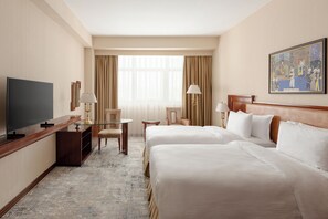 Luxe beddengoed, een minibar, een kluis op de kamer, een bureau