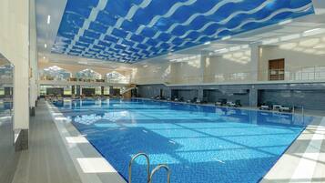 Indoor pool, seasonal outdoor pool, pool umbrellas, pool loungers