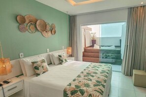 A bedroom with a bed, nightstands, a wall art piece, and a balcony with a potted plant. - Hotel Paradiso del Sol (Cabo Frio)