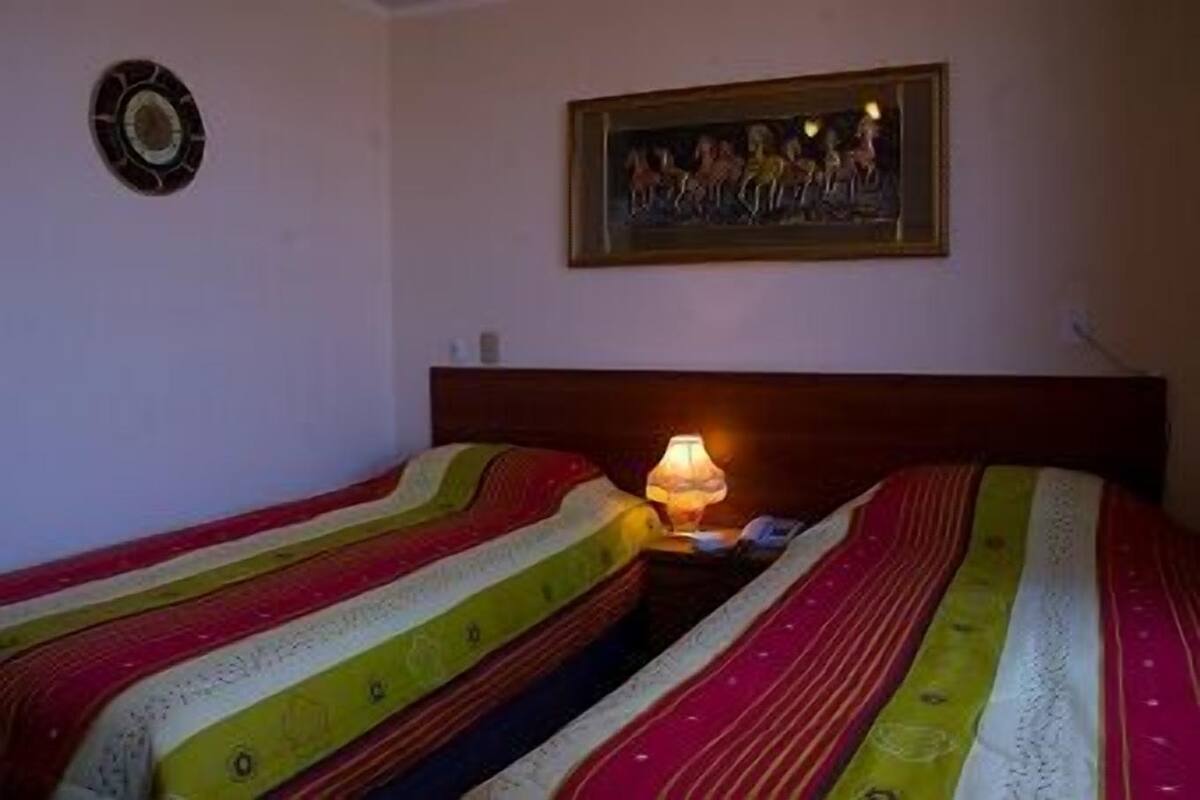 Standard Double Room | Minibar, in-room safe, individually decorated, desk