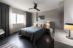 Desk, laptop workspace, blackout curtains, free WiFi