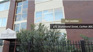 A multi-story building with a sign reading "Drummond Serviced Apartments" at 371 Drummond Street, Carlton 3053. - Drummond Apartments Services (Carlton)