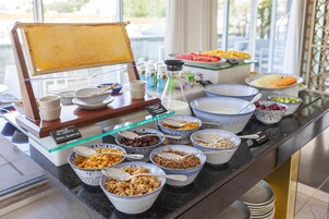 A buffet with various food items and a honeycomb display.