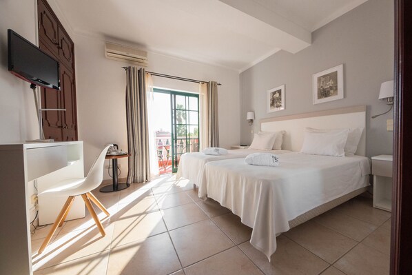 Hypo-allergenic bedding, pillow-top beds, minibar, in-room safe