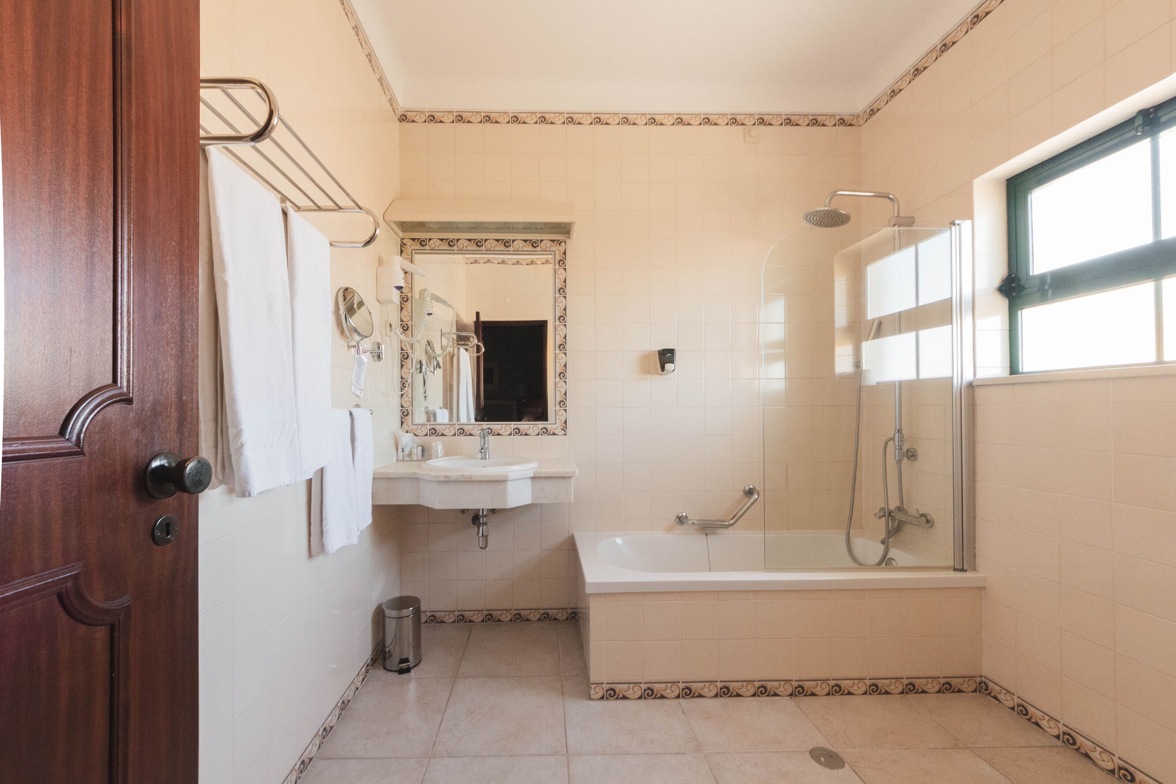 rainfall showerhead, hair dryer, towels, soap