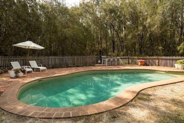 Seasonal outdoor pool, pool loungers